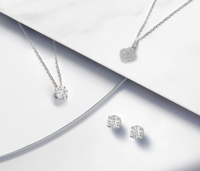 Two necklaces and earrings from the Illusion collection. Small marquise and round brilliant cut diamodns set together to maximise diamond impact and appear as one larger diamond.