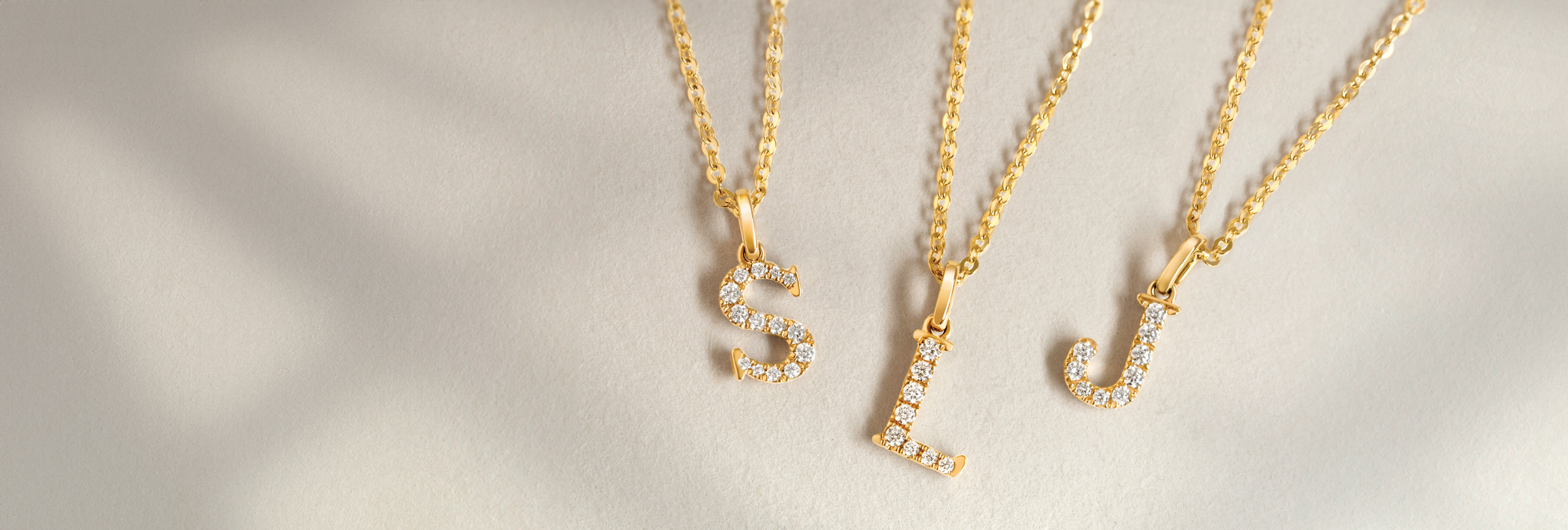Love Letters jewellery_18ct yellow gold, 18ct white gold initial necklaces; letter s, letter l, letter j