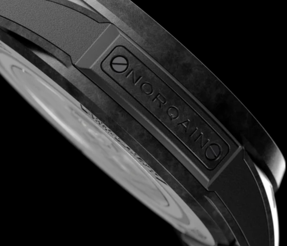 Close-up of a watch with 'NORQAIN' branding on a black background