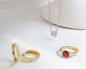 Pave Diamond Heart White Gold Necklace, Diamond Set Yellow Gold Hoop Earrings and Yellow Gold Three Stone Ruby and Diamond Ring