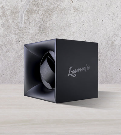 Navy Lunn's branded watch winder box on cool tone background
